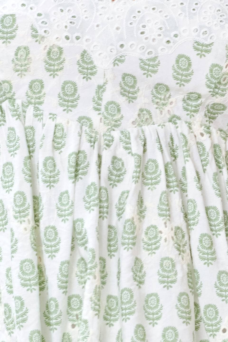 A printed woven eyelet top green