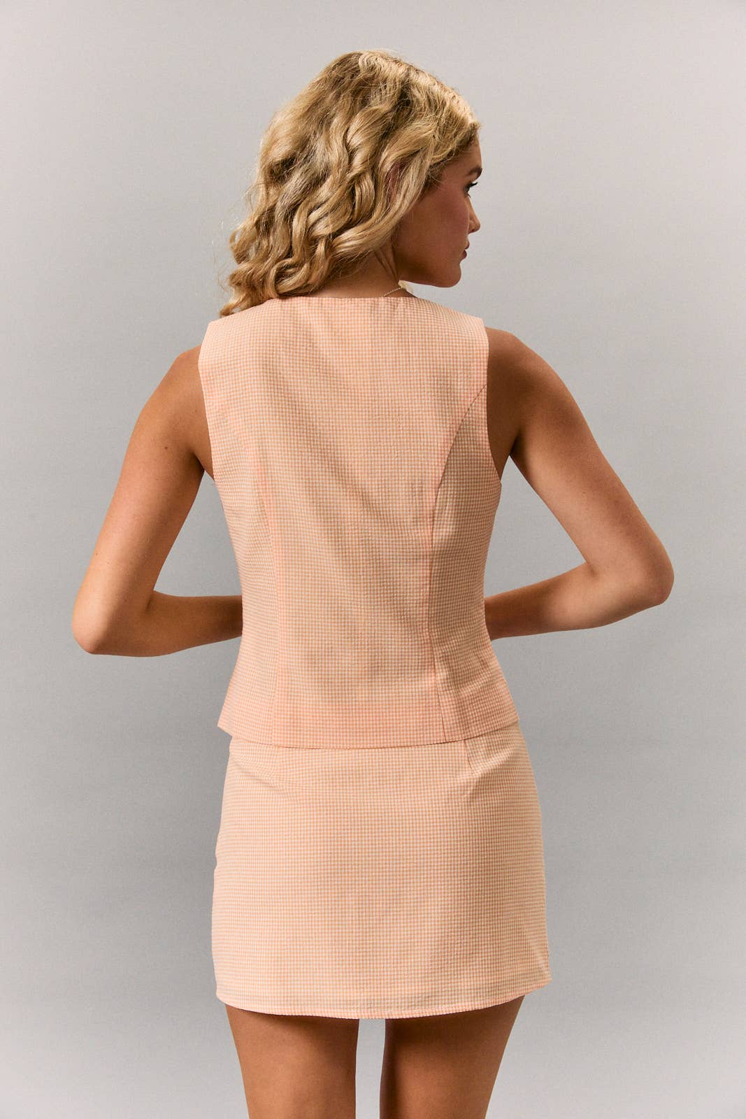 ROUND NECKLINE TOP WITH BUTTON UP FASTENING WITH MINI SKIRT