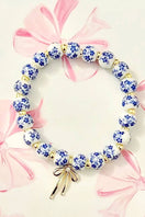 Switch BOW CHARM FLORAL PORCELAIN BLUE BRACELET 2 image